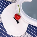 Cute cherry hair clip with bright red resin fruit and green stem on a duckbill clip - Cherry
