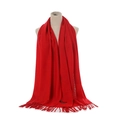 Detail of red cashmere scarf with tassels draped on a mannequin for winter warmth - Red