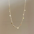 Elegant gold necklace featuring delicate chain and multiple small round sequin pendants - Sequin Necklace / Gold