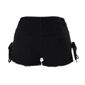 Detail view of black denim shorts featuring lace-up side ties and frayed raw hem edges - Black