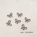 Set di 6 ciondoli a fiocco in acciaio inossidabile canna di fucile per DIY 13x16mm - Fiocco Senza Cuciture