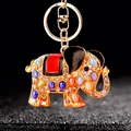 Golden elephant keychain with colorful gemstones and crystal accents on a dark background - Single OPP Bag Packaging / Red Elephant Style D