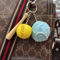 Detailed close-up of mini baseball glove, yellow ball and wooden bat keychain accessory - 3.5CM Yellow Ball Light Blue