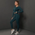 Detailed side view of high-waisted seamless scrunch butt yoga leggings in dark teal - Teal
