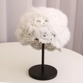 Close-up of white rabbit fur knit hat with hollow crochet design and wavy scalloped edge - White