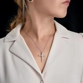 Silver cross pendant necklace with sparkling cubic zirconia on a minimalist model shot - Cross (762)