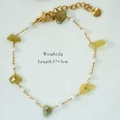 Detail of stainless steel gold bracelet with light green stones and white pearls - Light Yellow Green Stone Style (3027) / Gold