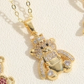 Detail of a gold bear pendant with white zircon stones and crown for a necklace - Gold / White Zircon Bear with Crown