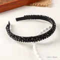 Elegant black beaded headband with four rows of crystal beads on white ceramic plate - Black