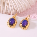 14K gold plated earrings with oval purple tourmaline-style gemstones on white surface - 14K Gold Oval Purple