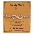 Detail of silver infinity mom bracelet with sparkling zircons on a brown gift card - Mother Style (F097)