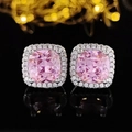 Pink cushion-cut halo stud earrings with silver plating on a black reflective background - Cushion Pink Style (E1097)