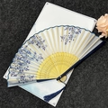 Classical bamboo folding fan with blue floral pattern and matching silk tassel - Blue and White Porcelain