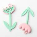 Detail of pink tulip flower and mushroom alloy pendants with mint green eyes for DIY jewelry - Pink