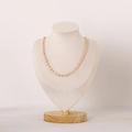 Elegant pale pink oval pearl necklace displayed on a natural solid wood jewelry bust stand - RBMT01 Medium Linen Necklace Bust