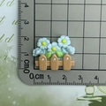 Detailed view of small resin blue flower fence charm for DIY crafts and hair accessories - Blue Flower Fence