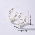 Detail view of silver C-shaped twist earrings with dimensions 2.3cm by 0.4cm and weight 6.0g - Silver-Twisted Texture C-Shape