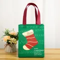 Green Christmas non-woven gift bag with red handles and festive stocking print - 26x21x10cm / Christmas Green Style