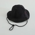 Detail view of black nylon sun hat with red embroidery and adjustable windproof cord - 52cm / Black