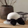 White vintage fascinator hat with black mesh veil and large bow for cocktail parties - One Size / White Hat With Black Bow