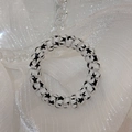 White spiral telephone wire hair tie with black star pattern for everyday styling - Star Style
