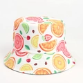 Detailed top view of a white bucket hat with colorful summer tropical fruit prints - Orange