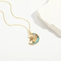 Exquisite gold unicorn crescent moon necklace with colorful stones on white stone base - Crescent Unicorn / Gold