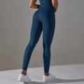 Detail showing high-waisted yoga pants with honeycomb texture and butt-lifting seam - Navy Blue