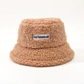 Detail of brown faux shearling bucket hat featuring a white embroidered letter logo patch - M (56-58cm) / Khaki