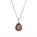 Macro shot of silver chain with brown sandstone teardrop Tree of Life pendant - Gold Sandstone