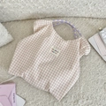 Detail of pink plaid tote bag with purple floral rope handles and logo patch - Wrinkled Light Pink Plaid