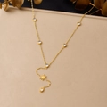 Detail of gold Y-shaped necklace with sun pendant, tassel, and clear zircon stones - Sun Pear Shaped Diamond Y-Shaped Tassel Style (N4112)