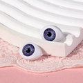 Vista macro di occhi per bambole in acrilico viola 14x19mm con trama dell'iride realistica - Viola