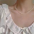 Baroque tiny irregular freshwater pearl choker necklace shown on neck with white lace top - 3mm Pearl (38+3cm)