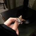 Silver spider web adjustable ring with clear zircon crystals held in hand - Style 13 Adjustable Ring