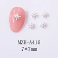Macro shot of silver starburst nail charms with center pearls and 7x7mm sizing - Silver Starburst Pearl (A416)