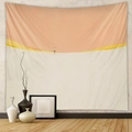 Detail view of a minimalist desert tapestry with a warm orange sun on a textured wall - Design CX0327-21