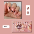 Detail of pink press-on nails with black leaf patterns and gold foil flakes, model W021 - W021 Gold Foil Tree Shadow