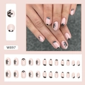 Short oval aurora nude pink press-on nails with minimalist black floral silhouettes - Black Petal (W897)