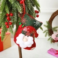 Mini red and green Christmas stocking with Santa Claus face and snowflake hanging on pine - Snowflake Santa / Small