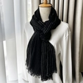 Elegant black silk scarf with vertical silver stripes and tassel details on a model - 190cmx75cm / Fine Black Striped