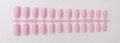 Detailed view of pink long square matte press-on nails displayed on a plastic strip - Pink