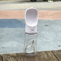 Portable white pet water bottle for dogs with paw-print button and grey carrying strap - 550ml-With Lock / White