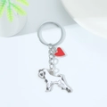 Metal keychain featuring a silver Schnauzer dog charm and a red enamel heart pendant - White Schnauzer (White Dog Red Heart)