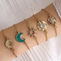 Five-piece gold bohemian bracelet set with moon and star charms on white lace background - Crescent Style (sku6394)
