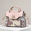 Pink PU leather handbag with floral fabric panels, gold hardware and pearl tassel - Jacquard Flower/Metal Swan Buckle / Flower Pink