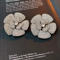 Detail of flower stud earrings with sparkling rhinestones on a vintage book page - 9# Silver Full Rhinestone Five-Petal Flower (925 Sterling Silver Earring Post)