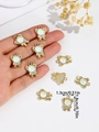 Detail shot of golden alloy bear bow charm with white pearl bead for DIY jewelry making - Light Green