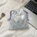Detail of light blue velvet bear pouch with purple drawstring for makeup storage - Light Blue