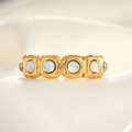 Macro detail of gold vintage ring featuring four iridescent round opal gemstones in square frames - Adjustable Open / 18K Gold White Translucent Stone